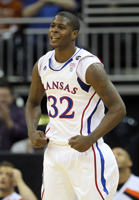 KANSAS CITY, MO - MARCH 10:  Josh Selby #32 of the Kansas Jayhawks reacts to a play against the Oklahoma State Cowboys during their quarterfinal game in the 2011 Phillips 66 Big 12 Men's Basketball Tournament at Sprint Center on March 10, 2011 in Kansas C