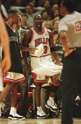 20 Apr 1996:  As teammate Scottie Pippen holds him back, guard Michael Jordan of the Chicago Bulls has words for referee Hugh Hollins, foreground, who called a foul on Jordan with .05 seconds to go in the game allowing Indiana Pacer Eddie Johnson to makea