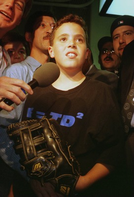 9 Oct 1996: An interviewer speaks to Yankees fan Jeffrey Maier, the twelve year old who caught a fly ball to right field over outfielder Tony Tarasco of the Baltimore Orioles that was ruled a home run in a controversial decision during the first game of t