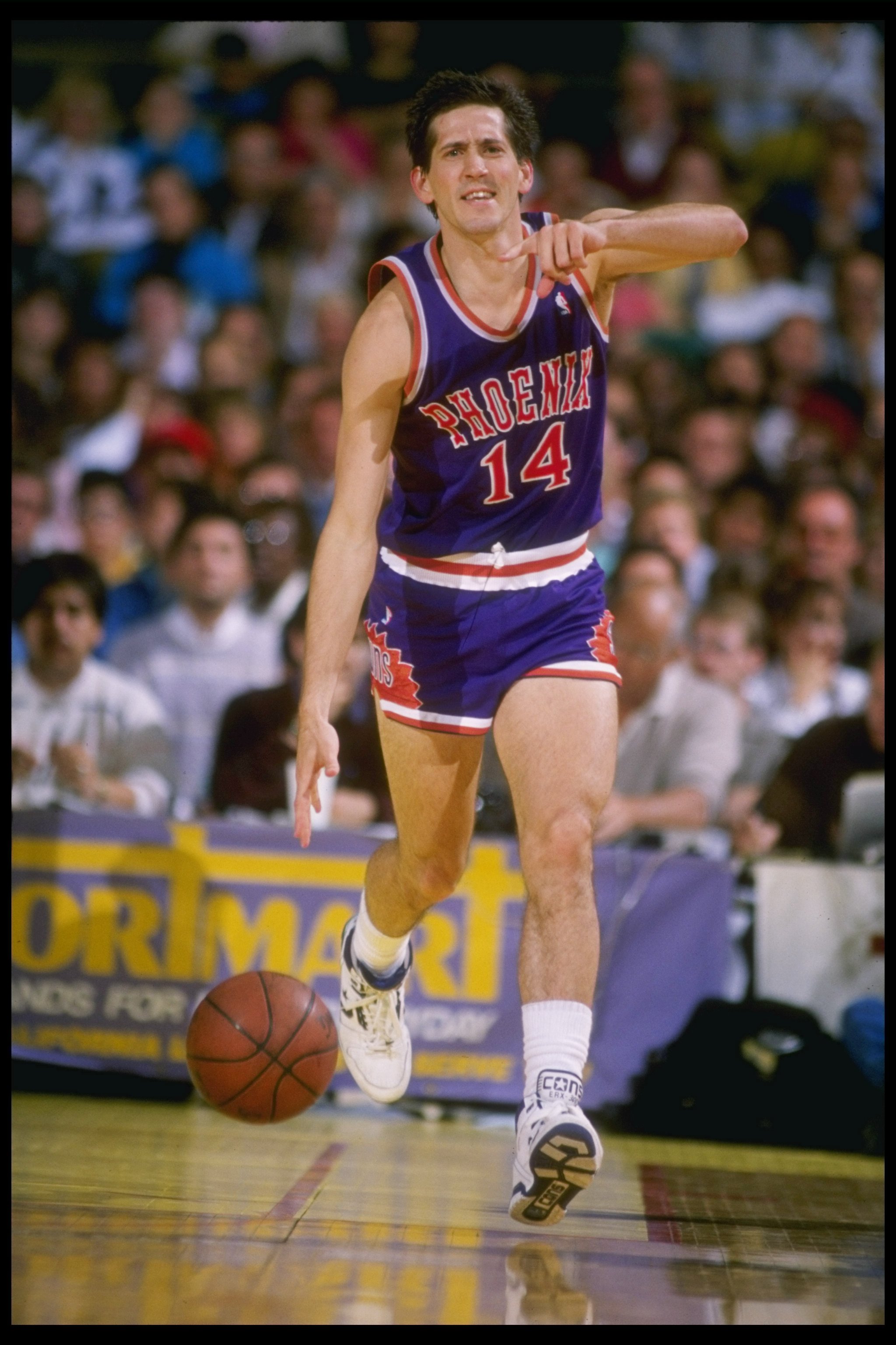 Kevin Johnson of the Phoenix Suns dribbles up court during a 1989 News  Photo - Getty Images