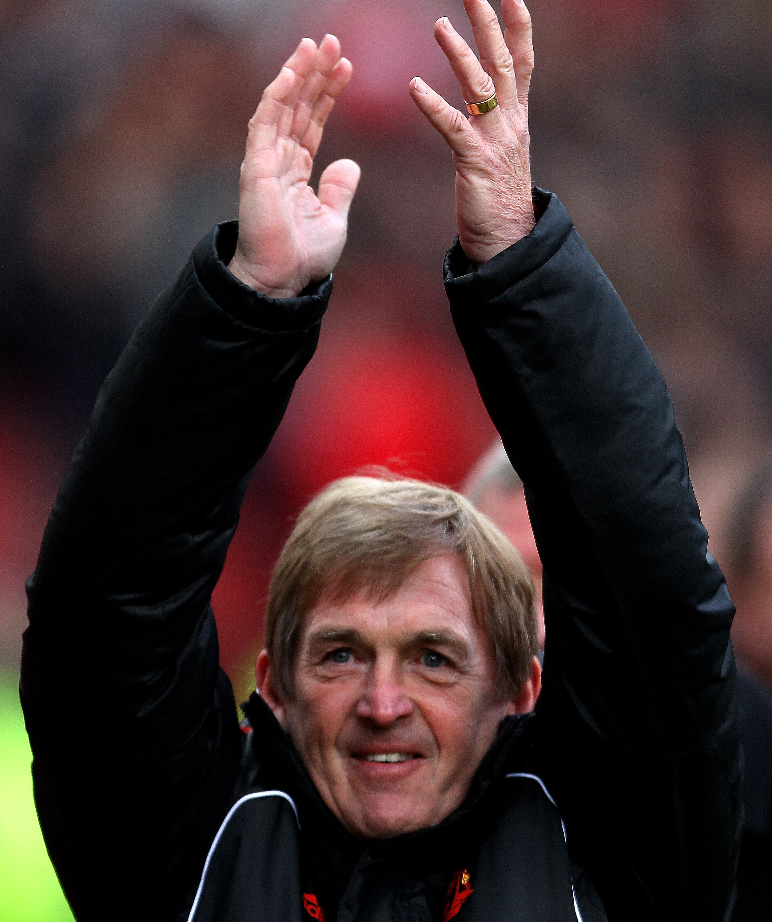 MANCHESTER, ENGLAND - JANUARY 09:  Liverpool Manager Kenny Dalglish salutes the fans prior to the FA Cup sponsored by E.ON 3rd round match between Manchester United and Liverpool at Old Trafford on January 9, 2011 in Manchester, England.  (Photo by Alex L