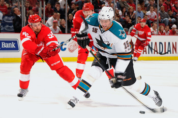 DETROIT - MAY 4:  Dany Heatley #15 of the San Jose Sharks unleashes a shot as Niklas Kronwall #55 of the Detroit Red Wings defends in the first period in Game Three of the Western Conference Semifinals during the 2011 NHL Stanley Cup Playoffs on May 4, 20