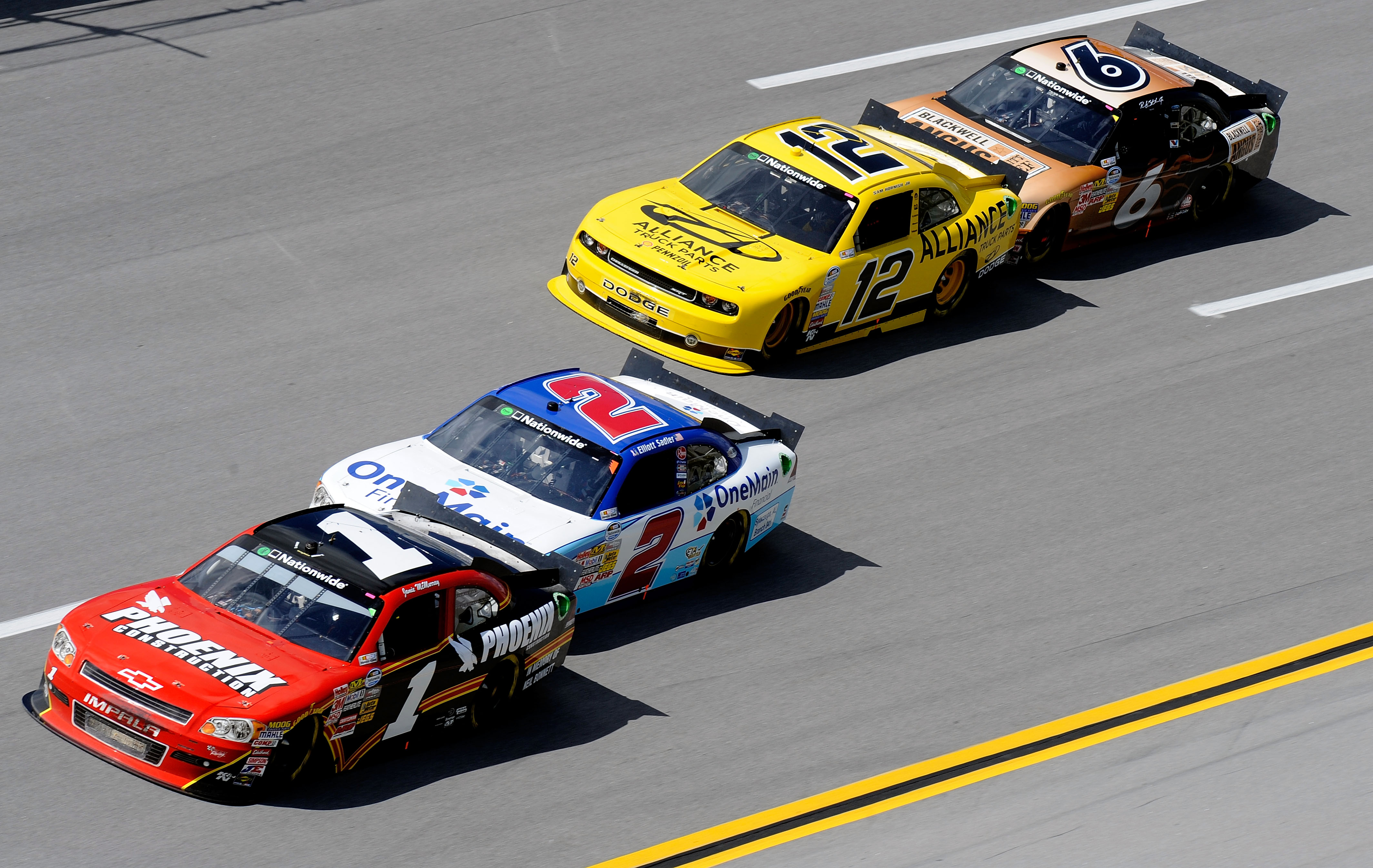 TALLADEGA, AL - APRIL 16:  Jamie McMurray, driver of the #1 Phoenix Construction Chevrolet, leads Elliott Sadler, driver of the #2 OneMain Financial Chevrolet, Sam Hornish Jr., driver of the #12 Alliance Truck Parts Dodge, and Ricky Stenhouse Jr., driver 