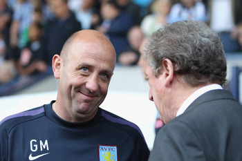 WEST BROMWICH, ENGLAND - APRIL 30: Gary McCallister (L) assistant manager of Villa chats with Roy Hodgson (R) manager of West Brom before the Barclays Premier League match between West Bromwich Albion and Aston Villa at The Hawthorns on April 30, 2011 in