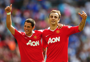 LONDON, ENGLAND - AUGUST 08:  Dimitar Berbatov of Manchester United (R) celebrates with Javier Hernandez as he scores their third goal during the FA Community Shield match between Chelsea and Manchester United at Wembley Stadium on August 8, 2010 in Londo