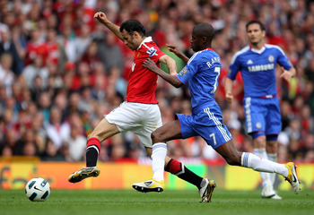 MANCHESTER, ENGLAND - MAY 08:  Ryan Giggs of Manchester United competes with Ramires of Chelsea during the Barclays Premier League match between Manchester United and Chelsea at Old Trafford on May 8, 2011 in Manchester, England.  (Photo by Alex Livesey/G