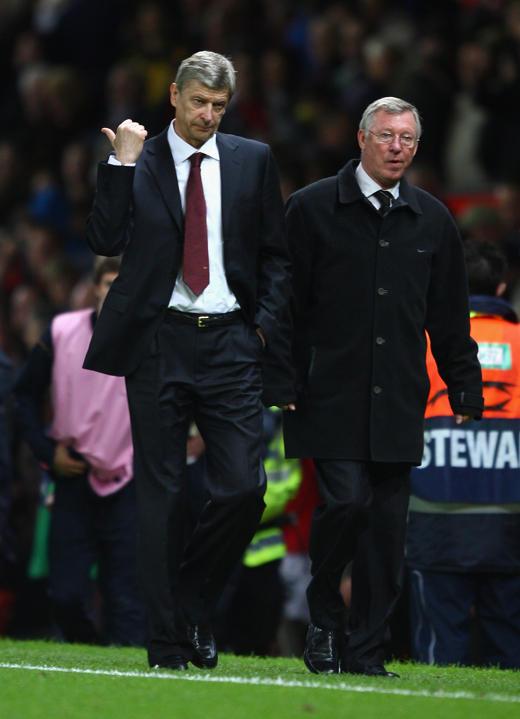 MANCHESTER, UNITED KINGDOM - APRIL 29:   Arsenal Manager Arsene Wenger gestures as he walks off with Manchester United Manager Sir Alex Ferguson at the end of the UEFA Champions League Semi Final First Leg match between Manchester United and Arsenal at Ol