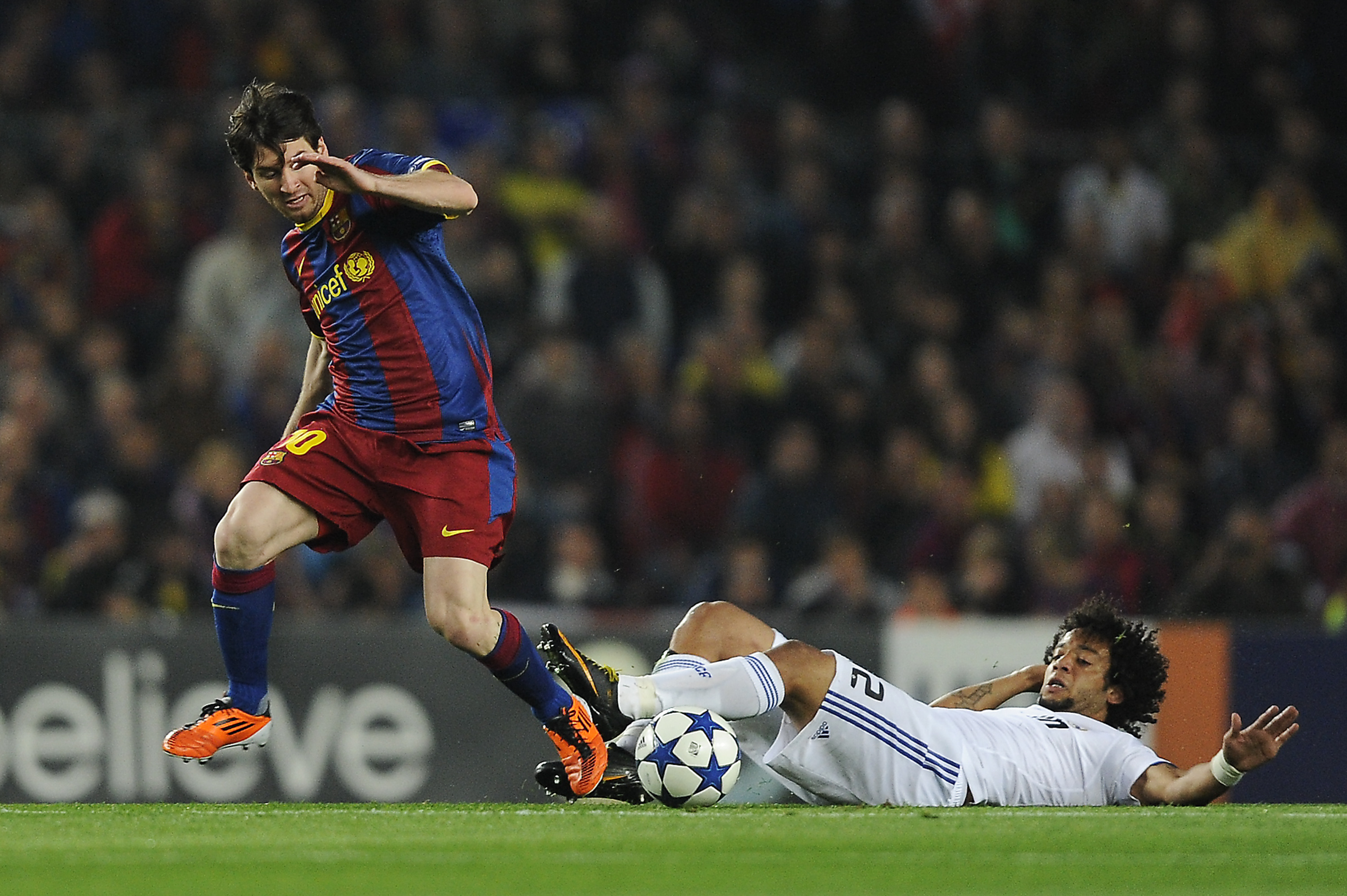 BARCELONA, SPAIN - MAY 03:  Lionel Messi of FC Barcelona (L) fights for the ball against Marcelo Real Madrid during the UEFA Champions League Semi Final second leg match between Barcelona and Real Madrid at the Camp Nou on May 3, 2011 in Barcelona, Spain.