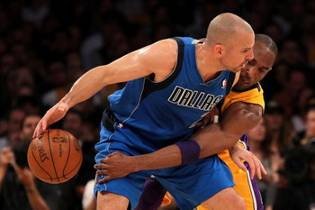 LOS ANGELES, CA - MAY 04:  Jason Kidd #2 of the Dallas Mavericks moves the ball as Kobe Bryant #24 of the Los Angeles Lakers goes for the steal in the first quarter in Game Two of the Western Conference Semifinals in the 2011 NBA Playoffs at Staples Cente