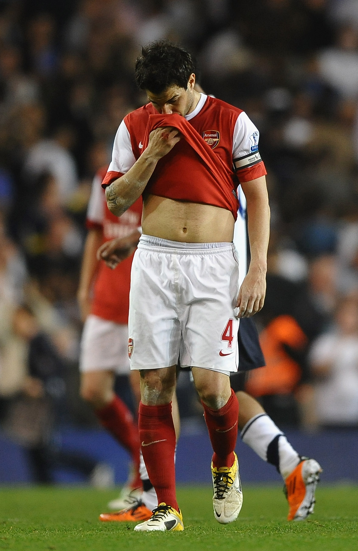 LONDON, ENGLAND - APRIL 20:  Cesc Fabregas of Arsenal walks off dejected after the Barclays Premier League match between Tottenham Hotspur and Arsenal at White Hart Lane on April 20, 2011 in London, England.  (Photo by Laurence Griffiths/Getty Images)