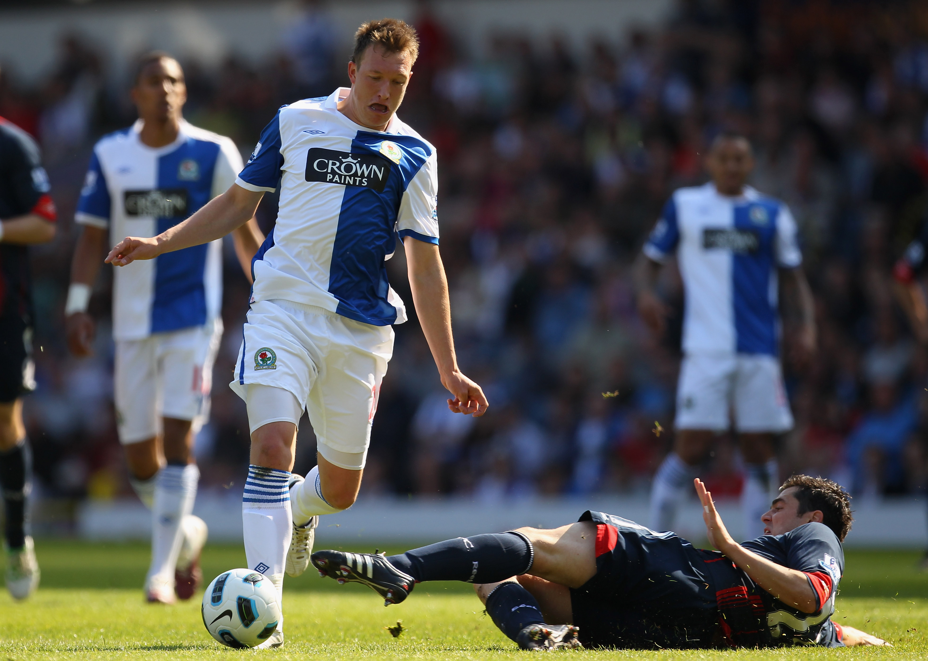 BLACKBURN, ENGLAND - APRIL 30:  Phil Jones of Blackburn Rovers is tackled by Tamir Cohen of Bolton Wanderers during the Barclays Premier League match between Blackburn Rovers and Bolton Wanderers at Ewood Park on April 30, 2011 in Blackburn, England.  (Ph