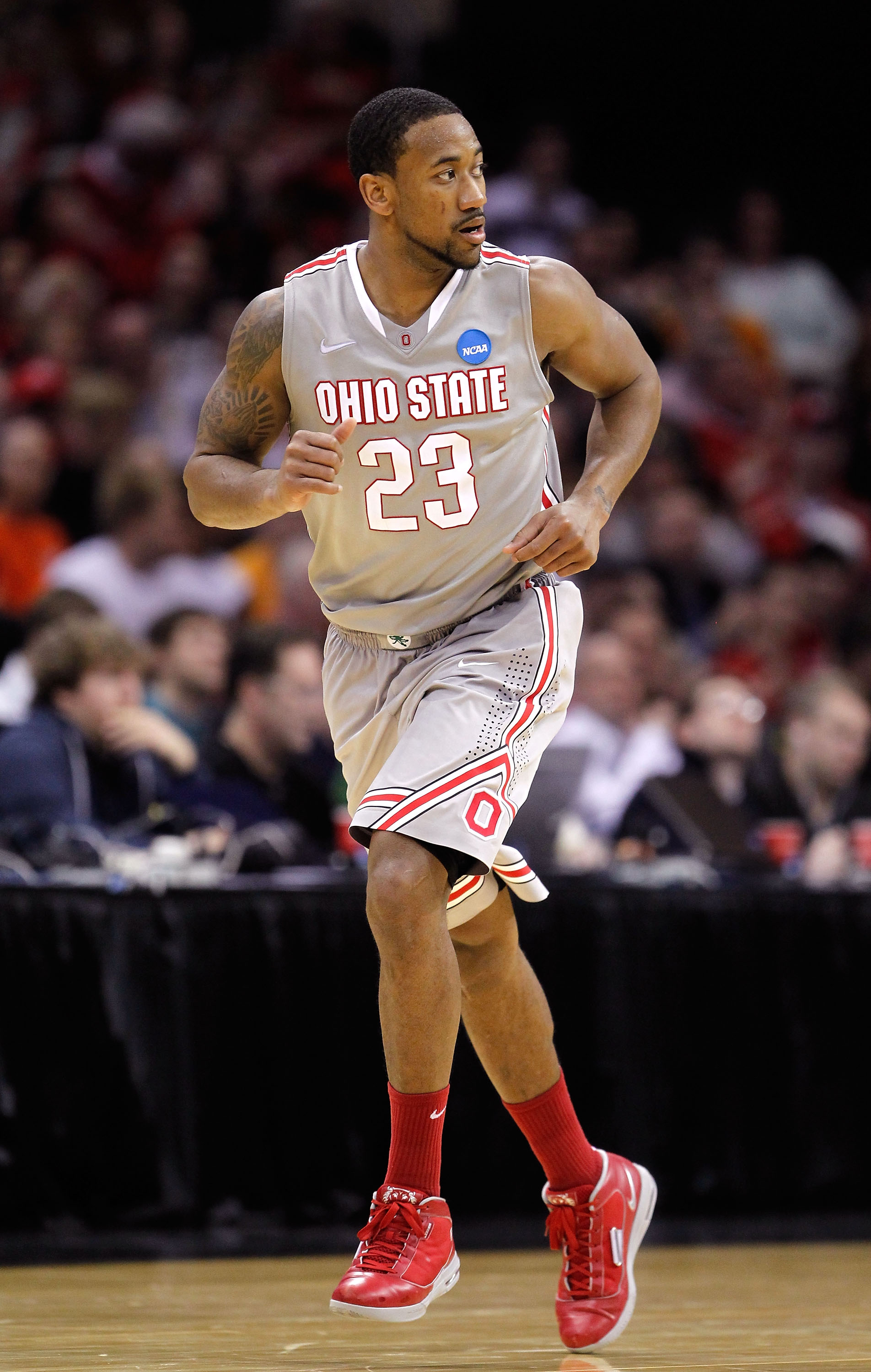 CLEVELAND, OH - MARCH 20: David Lighty #23 of the Ohio State Buckeyes runs up court after a play against the George Mason Patriots during the third of the 2011 NCAA men's basketball tournament at Quicken Loans Arena on March 20, 2011 in Cleveland, Ohio.