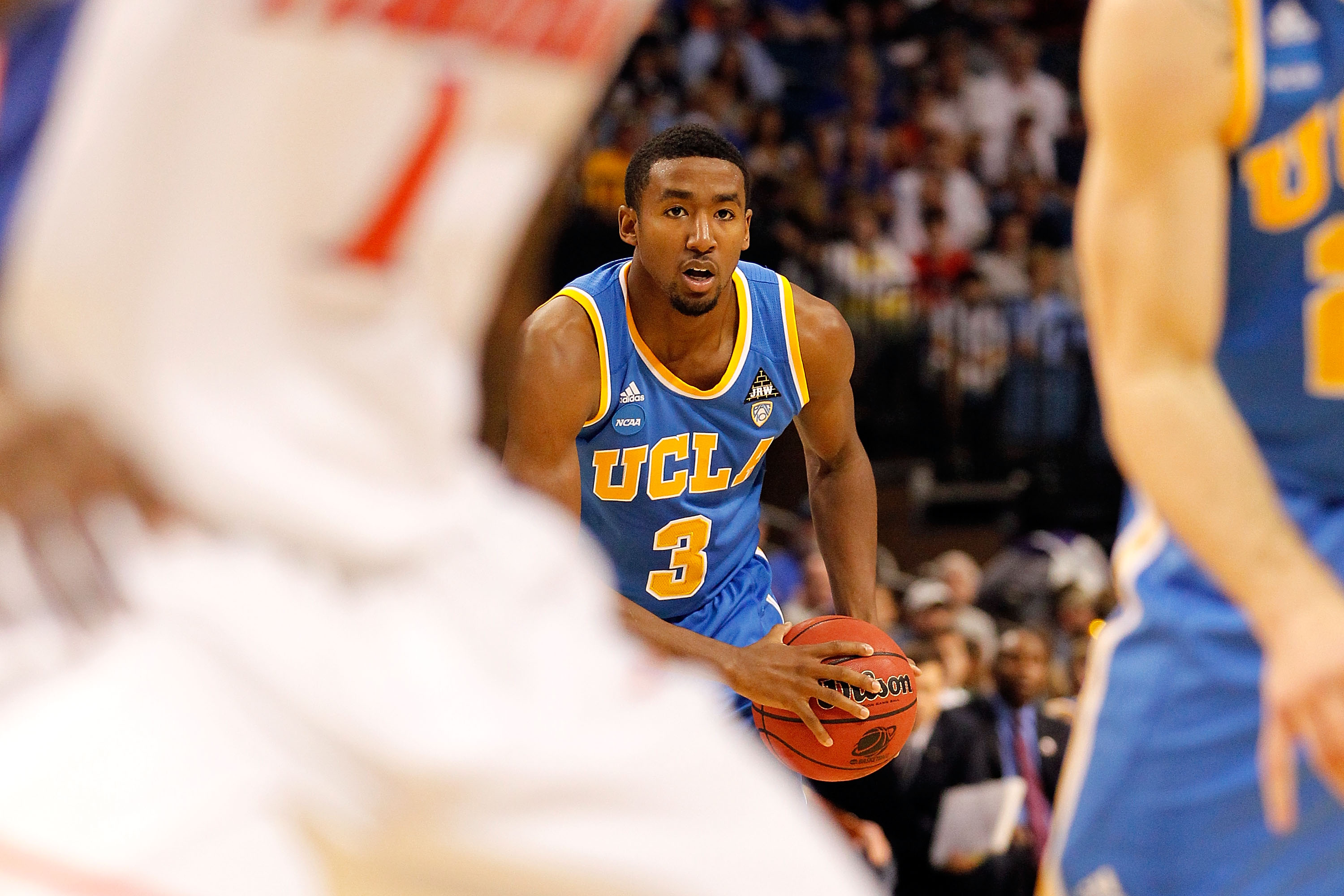 TAMPA, FL - MARCH 19: Malcolm Lee #3 of the UCLA Bruins looks to pass the ball against the Florida Gators during the third round of the 2011 NCAA men's basketball tournament at St. Pete Times Forum on March 19, 2011 in Tampa, Florida. Florida won 73-65.