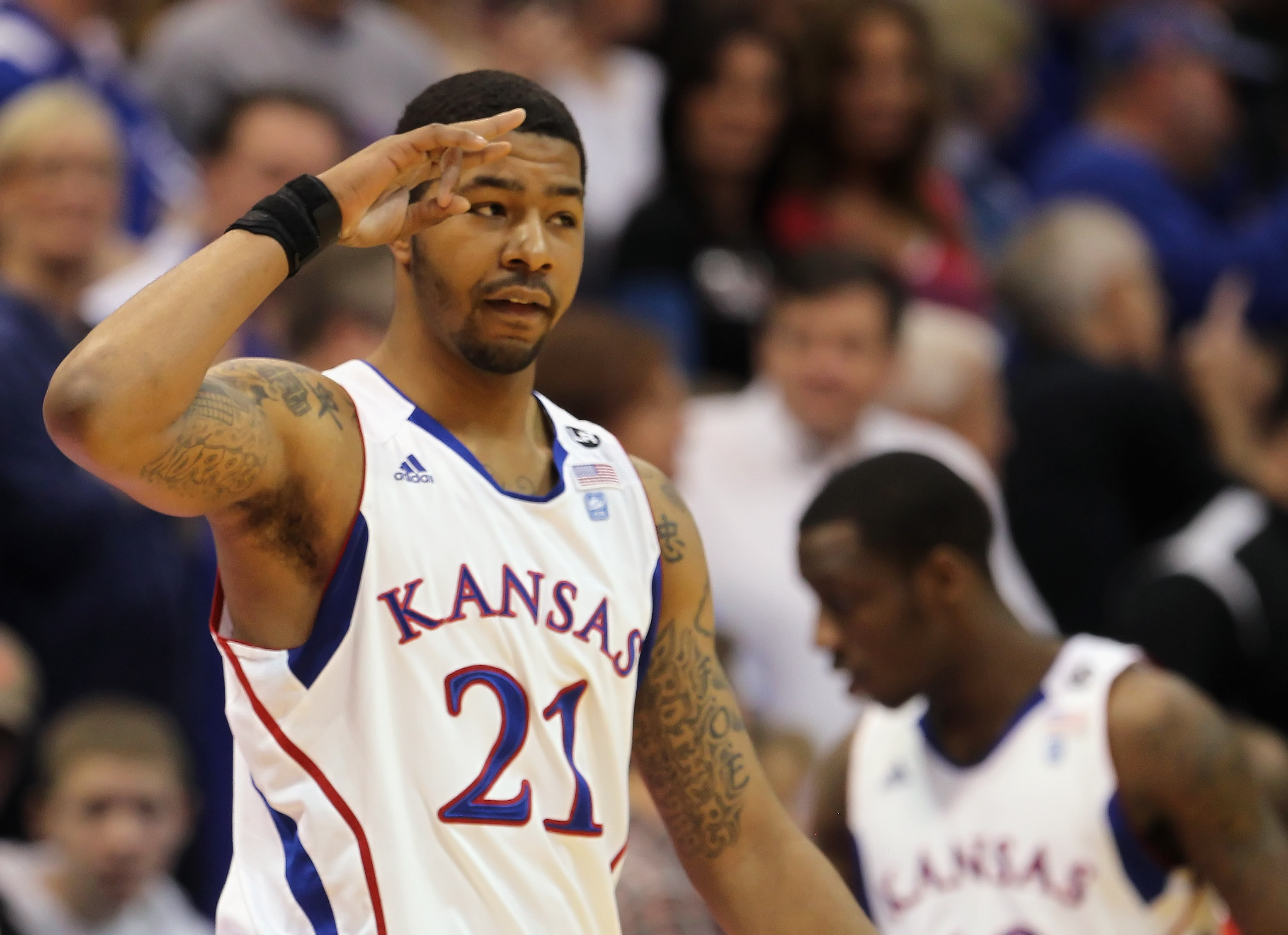 LAWRENCE, KS - FEBRUARY 12:  Markieff Morris #21 of the Kansas Jayhawks slautes the crowd during the game against the Iowa State Cyclones on February 12, 2011 at Allen Fieldhouse in Lawrence, Kansas.  (Photo by Jamie Squire/Getty Images)