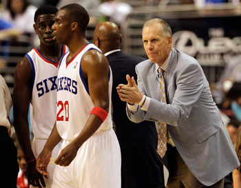 PHILADELPHIA, PA - APRIL 24: Coach Doug Collins of the Philadelphia 76ers gestures to players Jrue Holiday #11 (L) and Jodie Meeks #20 during the second half in Game Four of the Eastern Conference Quarterfinals in the 2011 NBA Playoffs at Wells Fargo Cent