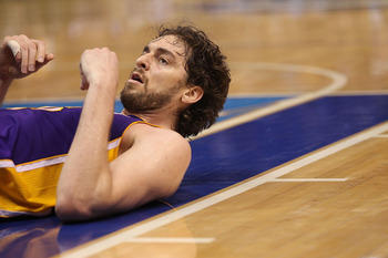 DALLAS, TX - MAY 08:  Forward Pau Gasol #16 of the Los Angeles Lakers on the ground after a foul by the Dallas Mavericks in Game Four of the Western Conference Semifinals during the 2011 NBA Playoffs on May 8, 2011 at American Airlines Center in Dallas, T