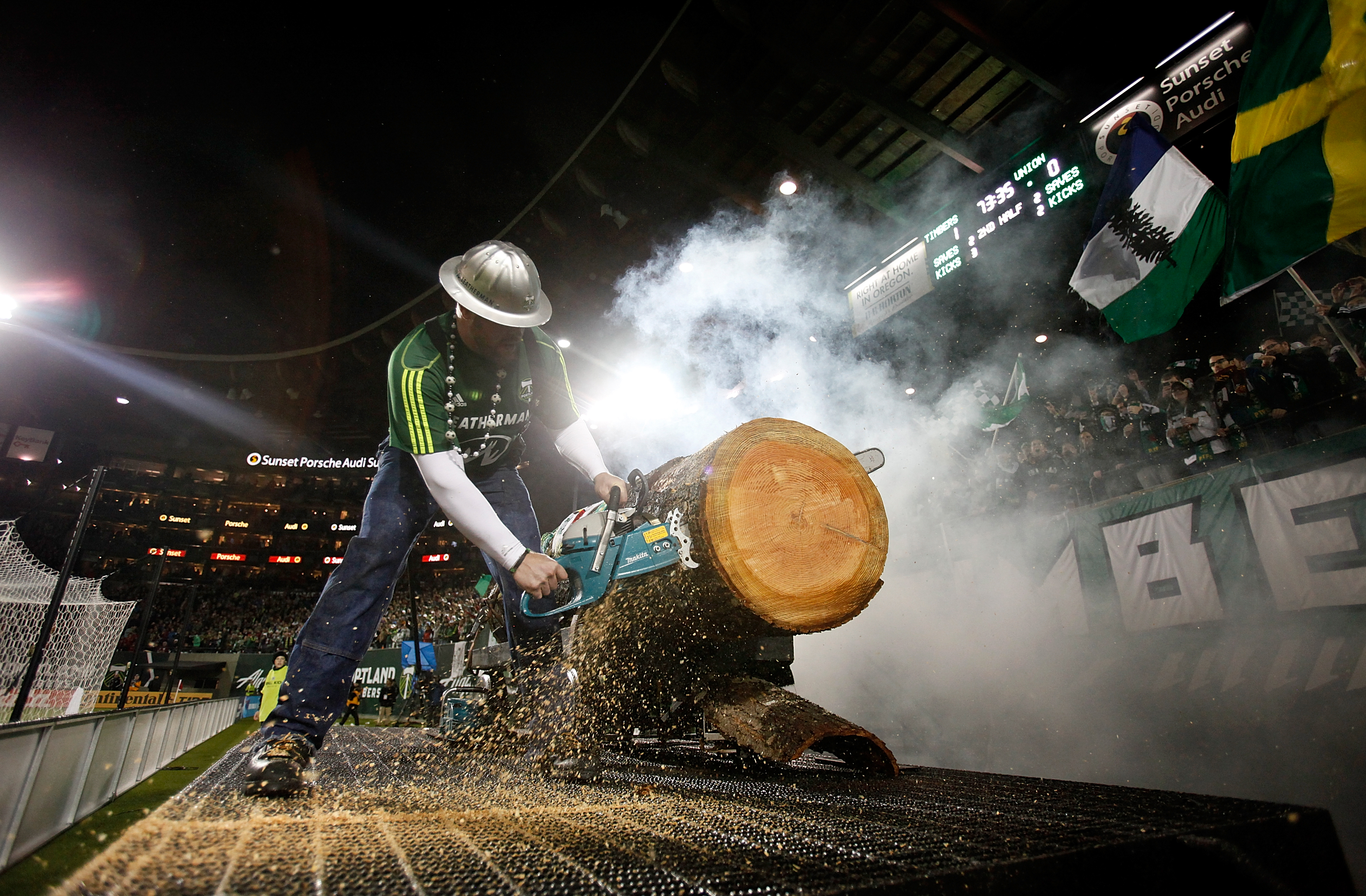 PORTLAND, OR - MAY 06: Mascot Timber Joey cuts a section of the log after the Portland Timbers score a gola in the second half against the Portland Timbers of the Philadelphia Union on May 6, 2011 at Jeld-Wen Field in Portland, Oregon. (Photo by Jonat