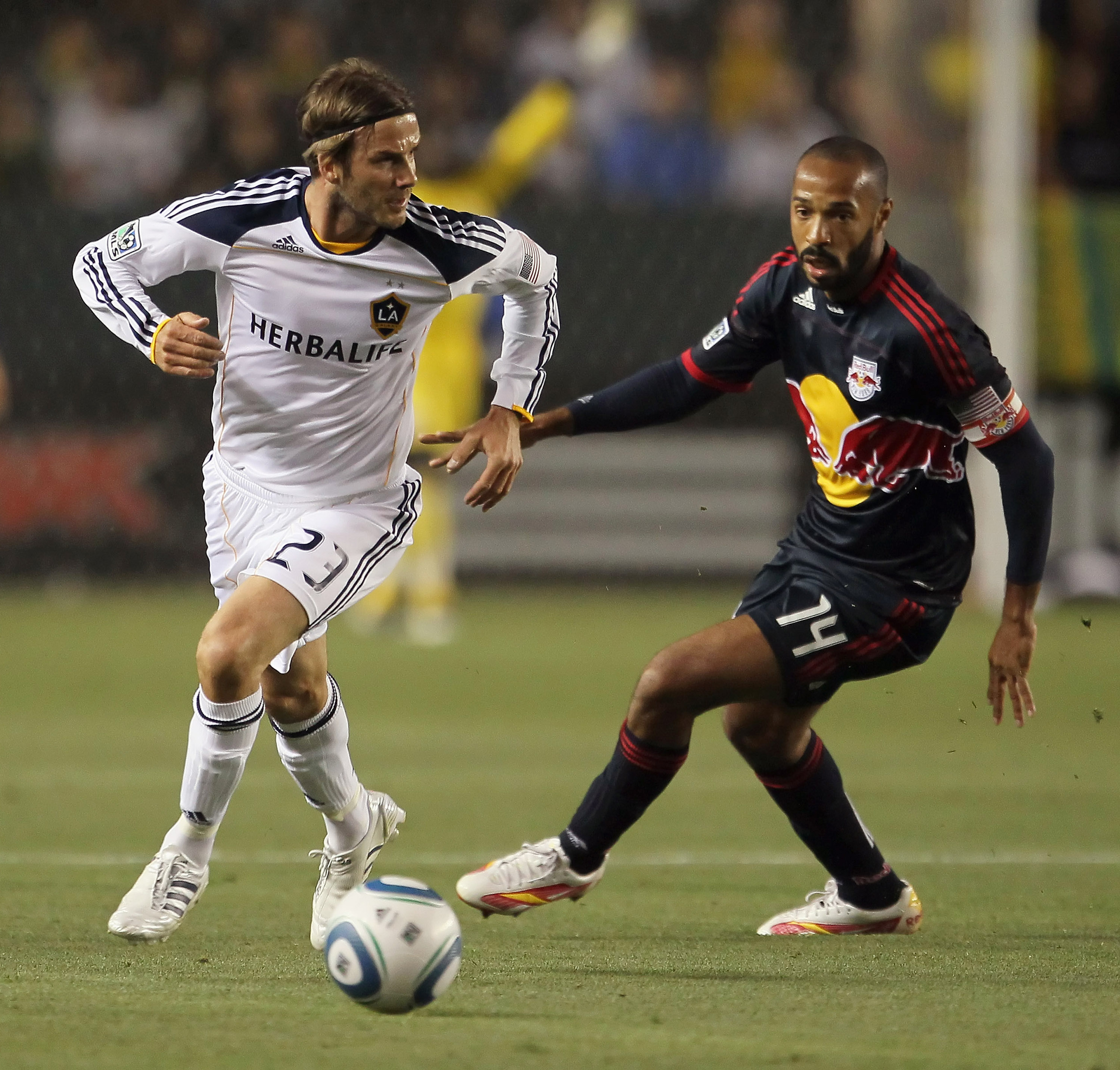 CARSON, CA - MAY 07: David Beckham #23 of the Los Angeles Galaxy is pursued by Thierry Henry #14 of the New York Red Bulls in the first half at The Home Depot Center on May 7, 2011 in Carson, California. The Red Bulls and Galaxy played to a 1-1 draw. (P