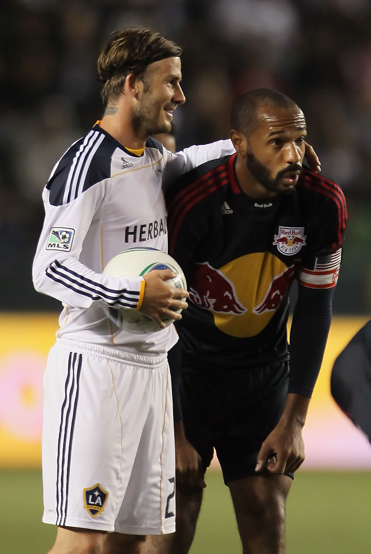 CARSON, CA - MAY 07: David Beckham (L) #23 of the Los Angeles Galaxy puts his arm around Thierry Henry #14 of the New York Red Bulls in the second half at The Home Depot Center on May 7, 2011 in Carson, California. The Red Bulls and Galaxy played to a 1-