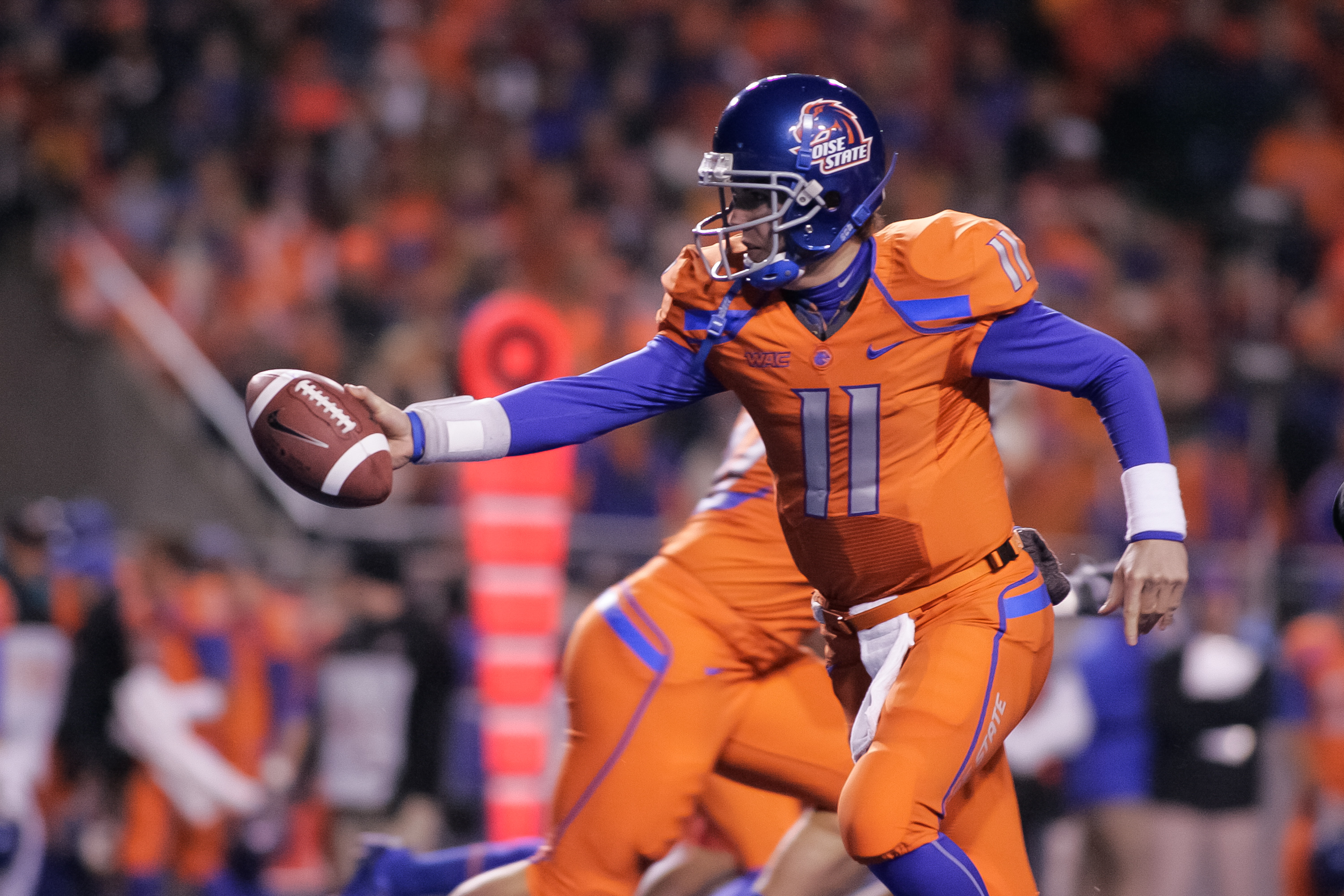 BOISE, ID - NOVEMBER 19:  Kellen Moore #11 of the Boise State Broncos hands off the ball against the Fresno State Bulldogs at Bronco Stadium on November 19, 2010 in Boise, Idaho.  (Photo by Otto Kitsinger III/Getty Images)