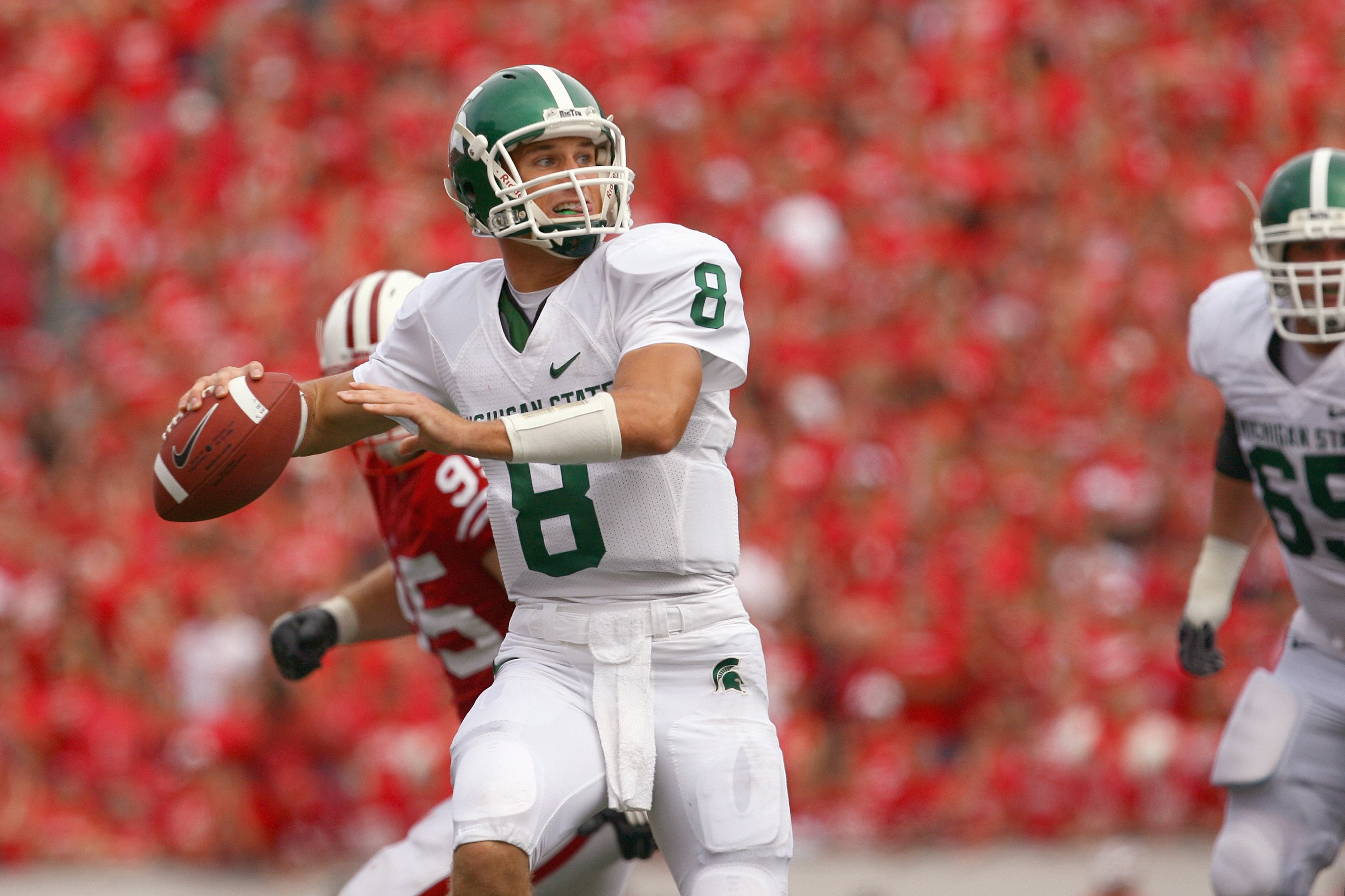 MADISON, WI - SEPTEMBER 26: Kirk Cousins #8 of the Michigan State Spartans looks to pass the ball against the Wisconsin Badgers on September 26, 2009 at Camp Randall Stadium in Madison, Wisconsin. (Photo by Jonathan Daniel/Getty Images)