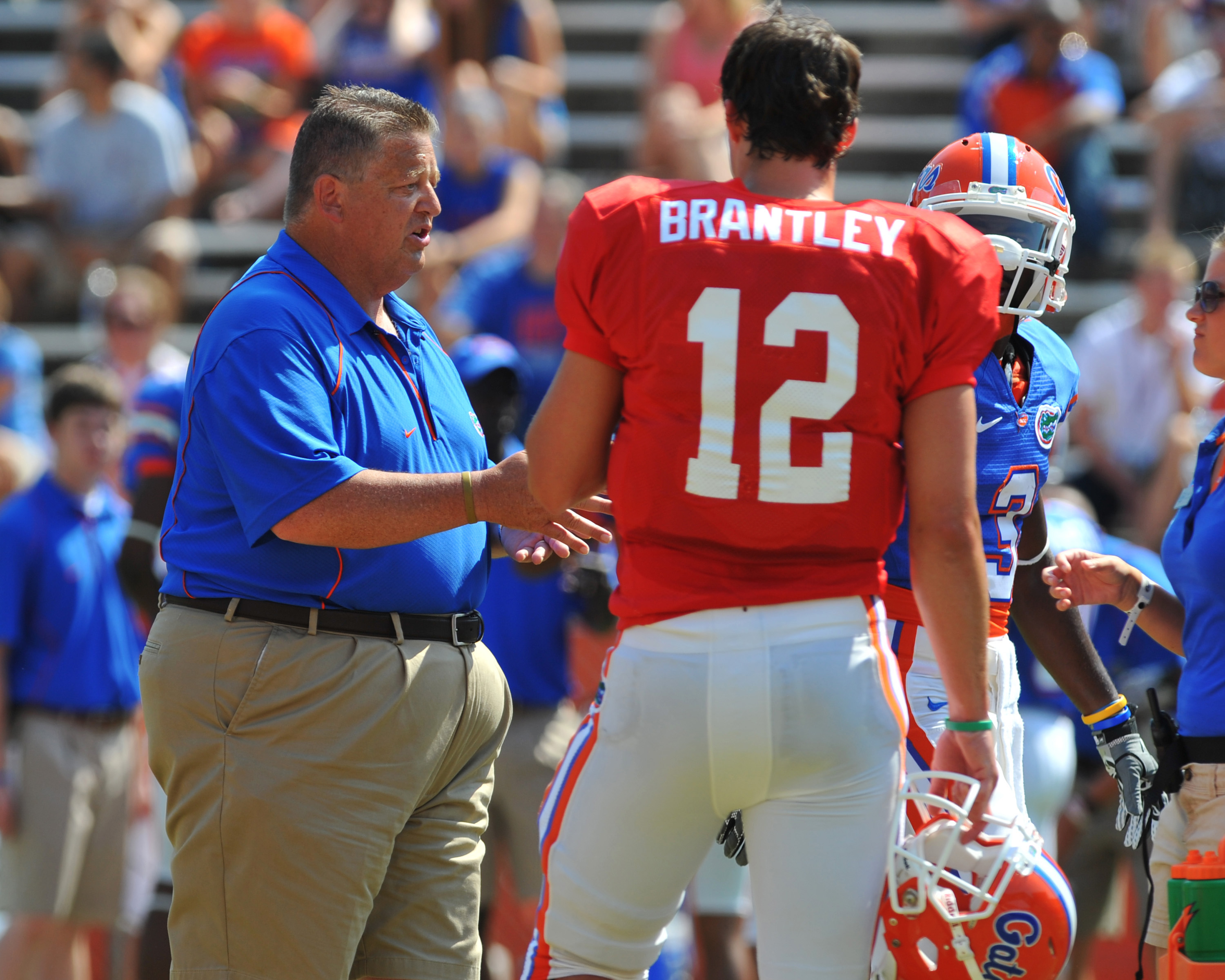 GAINESVILLE, FL - APRIL 9:  Offensive coordinator Charlie Weis of the Florida Gators directs play with quarterback John Bantley #12 during the Orange and Blue spring football game April 9, 2011 at Ben Hill Griffin Stadium in Gainesville, Florida.  (Photo