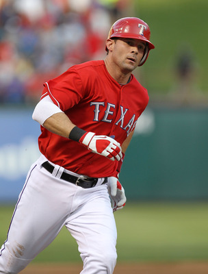 ARLINGTON, TX - MAY 07:  Michael Young #10 of the Texas Rangers hits a solo homerun against the New York Yankees at Rangers Ballpark in Arlington on May 7, 2011 in Arlington, Texas.  (Photo by Ronald Martinez/Getty Images)