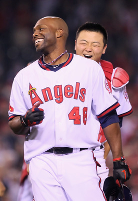 ANAHEIM, CA - MAY 06:  Torii Hunter #48 of the Los Angeles Angels of Anaheim is congratulated by Hank Conger #16 after hitting the game wining RBI single against the Cleveland Indians in the 11th inning at Angel Stadium of Anaheim on May 6, 2011 in Anahei
