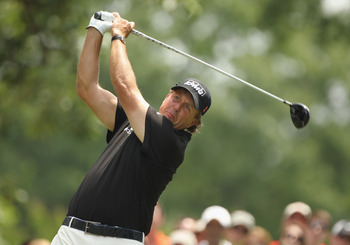 CHARLOTTE, NC - MAY 08:  Phil Mickelson watches his tee his shot on the fourth hole during the final round of the Wells Fargo Championship at the Quail Hollow Club on May 8, 2011 in Charlotte, North Carolina.  (Photo by Scott Halleran/Getty Images)
