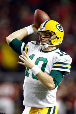 ATLANTA, GA - JANUARY 15:  Matt Flynn #10 of the Green Bay Packers losens up on the sideline against the Atlanta Falcons during their 2011 NFC divisional playoff game at Georgia Dome on January 15, 2011 in Atlanta, Georgia.  (Photo by Chris Graythen/Getty