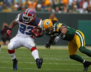 GREEN BAY, WI - SEPTEMBER 19: Nick Barnett #56 of the Green Bay Packers tackles Marshawn Lynch #23 of the Buffalo Bills at Lambeau Field on September 19, 2010 in Green Bay, Wisconsin. The Packers defeated the Bills 34-7. (Photo by Jonathan Daniel/Getty Im
