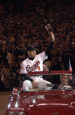 BALTIMORE - OCTOBER 6:  Cal Ripken Jr. #8 of the Baltimore Orioles waves to the crowd, while riding in a car, during the October 6, 2001 ceremony to honor Ripken's 3001st and final game of his career. After the ceremony, the Baltimore Orioles would lose t