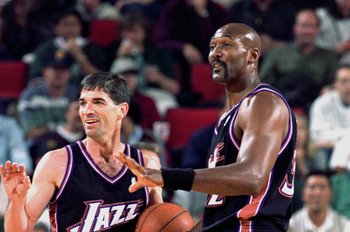 Former Utah Jazz guard John Stockton smiles as Karl Malone, left, kids with  him at a news conference prior to the retirement of Malone's jersey  Thursday, March 23, 2006, in Salt Lake