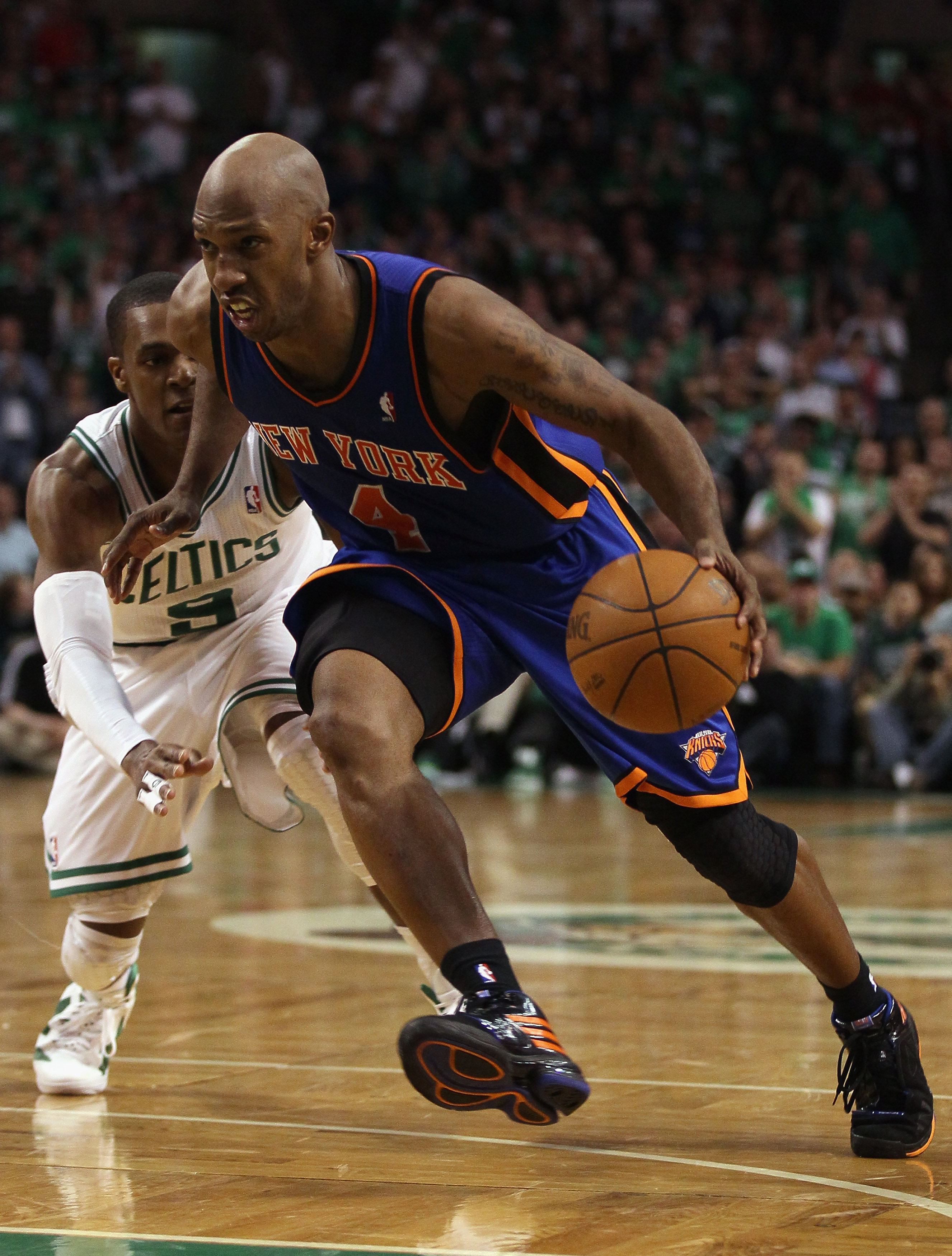 BOSTON, MA - APRIL 17:  Chauncey Billups #4 of the New York Knicks drives to the net as Rajon Rondo #9 of the Boston Celtics defends in Game One of the Eastern Conference Quarterfinals in the 2011 NBA Playoffs on April 17, 2011 at the TD Garden in Boston,