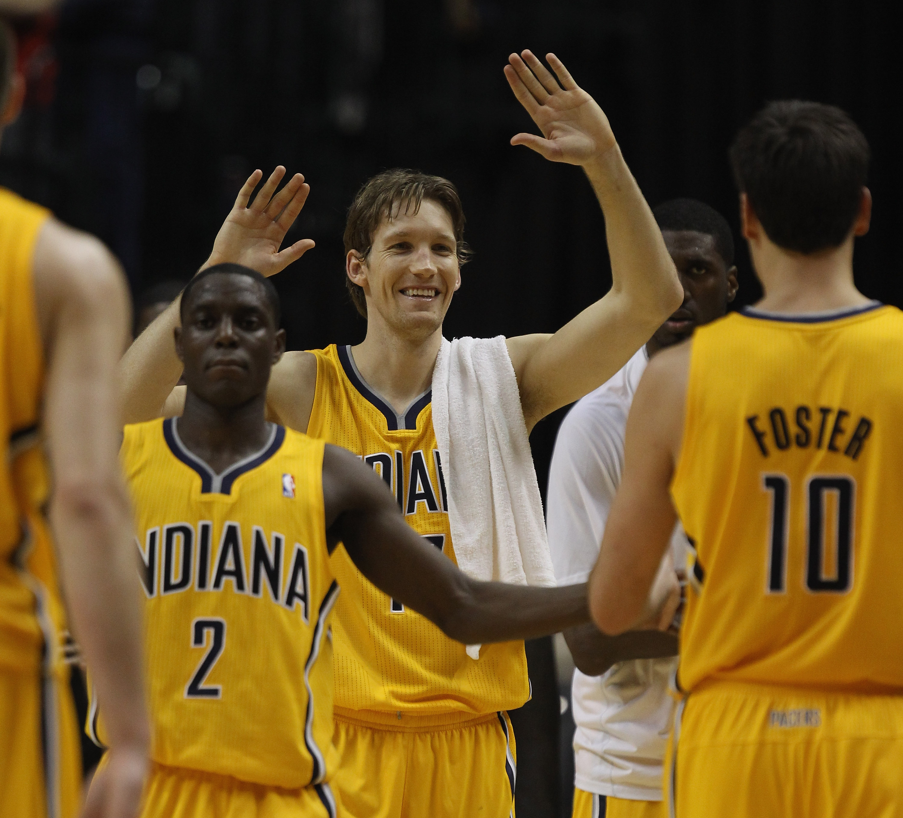 INDIANAPOLIS, IN - APRIL 23: Darren Collison #2 and Mike Dunleavy #17 of the Indiana Pacers welcome teammates to the bench during a time-out late against the Chicago Bulls in Game Four of the Eastern Conference Quarterfinals in the 2011 NBA Playoffs at Co