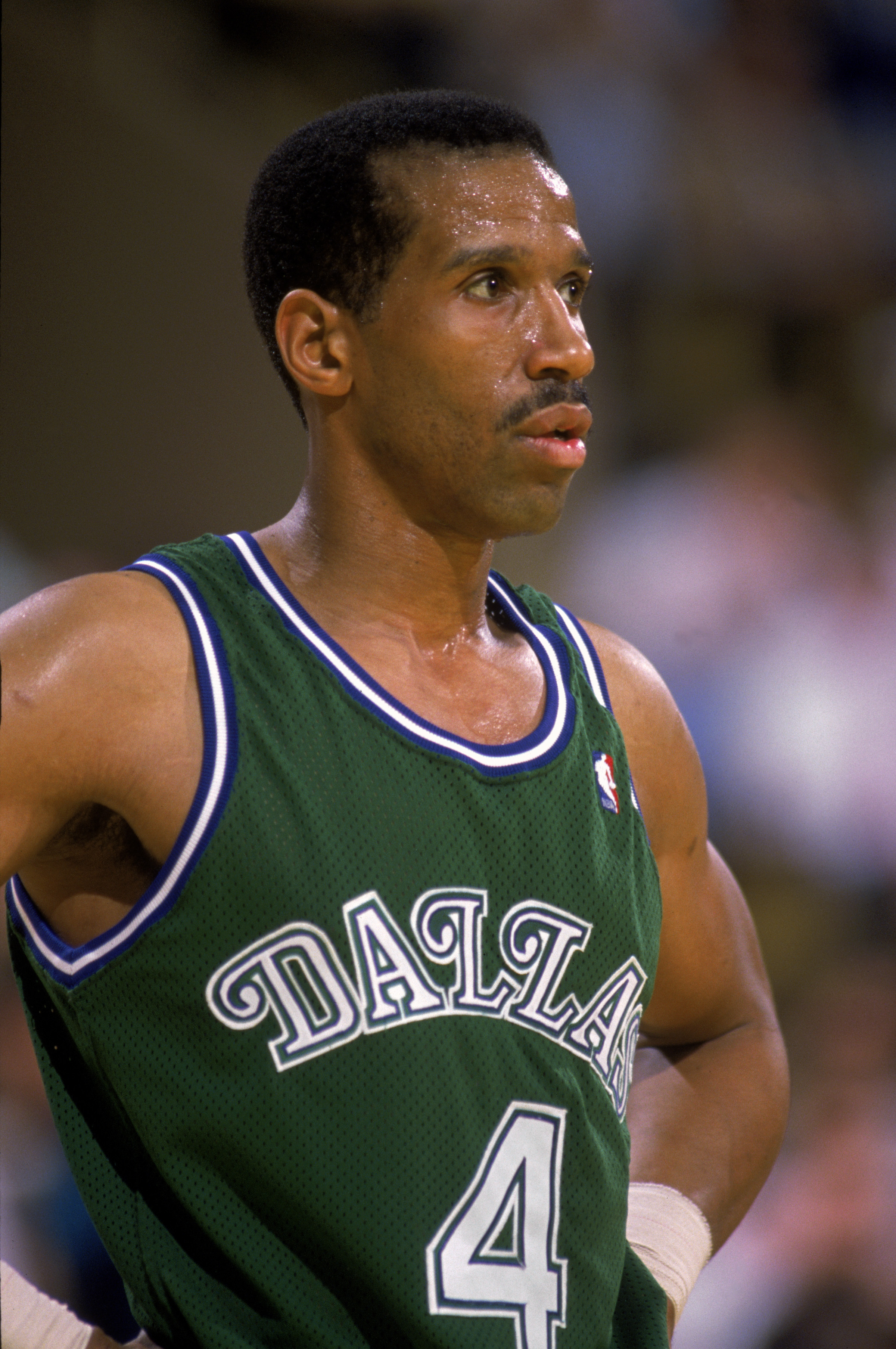 LOS ANGELES - 1989:  Adrian Dantley #4 of the Dallas Mavericks stands on the court during the NBA game against the Los Angeles Lakers at the Great Western Forum in Los Angeles, California in 1989.  (Photo by Stephen Dunn/Getty Images)