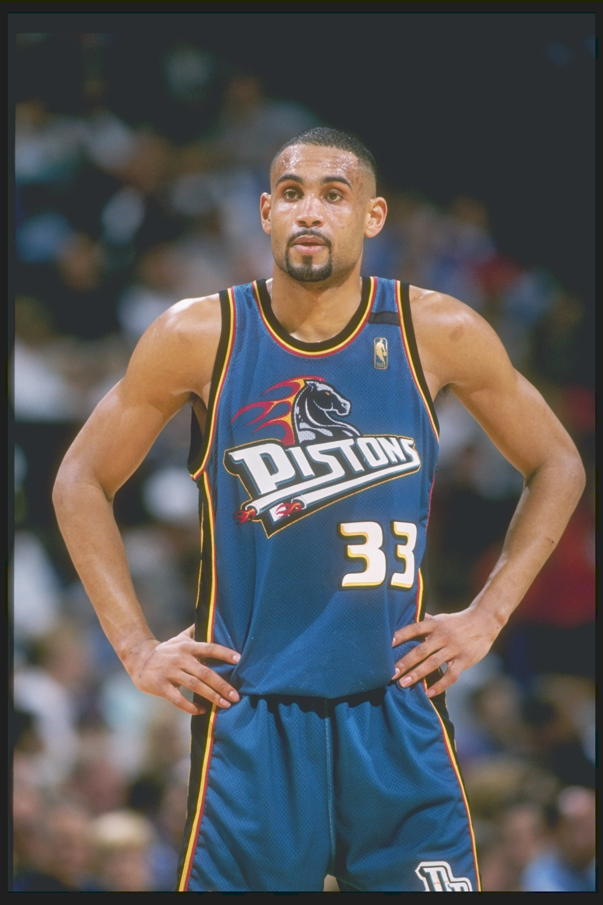 Forward Grant Hill of the Detroit Pistons stands on the court during a game against the Dallas Mavericks at Reunion Arena in Dallas, Texas. The Pistons won the game 100-82.