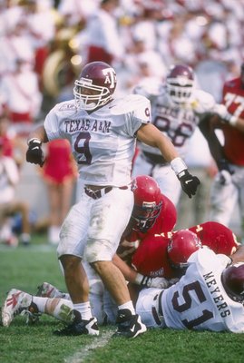 12 Oct 1996: Linebacker Dat Nguyen of the Texas A&M Aggies celebrates during a game against the Iowa State Cyclones at Cyclone Stadium in Ames, Iowa. Texas A&M won the game, 24-21. Mandatory Credit: Stephen Dunn /Allsport