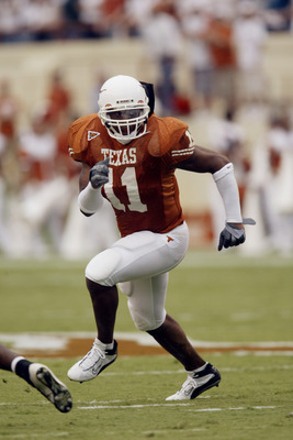 AUSTIN, TX - AUGUST 31:  Linebacker Derrick Johnson #11 of the University of Texas at Austin Longhorns runs during the game against the University of New Mexico Aggies at Texas Memorial Stadium on August 31, 2003 in Austin, Texas. Texas defeated New Mexic