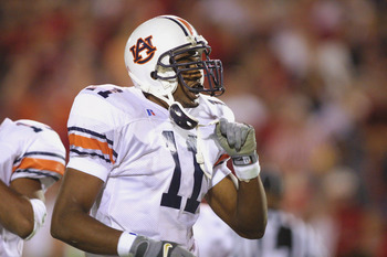 ATHENS, GA - NOVEMBER 10:  Linebacker Karlos Dansby #11 of the Auburn Tigers takes off his chin strap during the SEC football game against the Georgia Bulldogs on November 10, 2001 at Sanford Stadium in Athens, Georgia. Auburn won 24-17.  (Photo by Scott