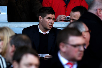 LIVERPOOL, ENGLAND - FEBRUARY 12:  Steven Gerrard of Liverpool looks on from the stands prior to the Barclays Premier League match between Liverpool and Wigan Athletic at Anfield on February 12, 2011 in Liverpool, England.  (Photo by Clive Brunskill/Getty