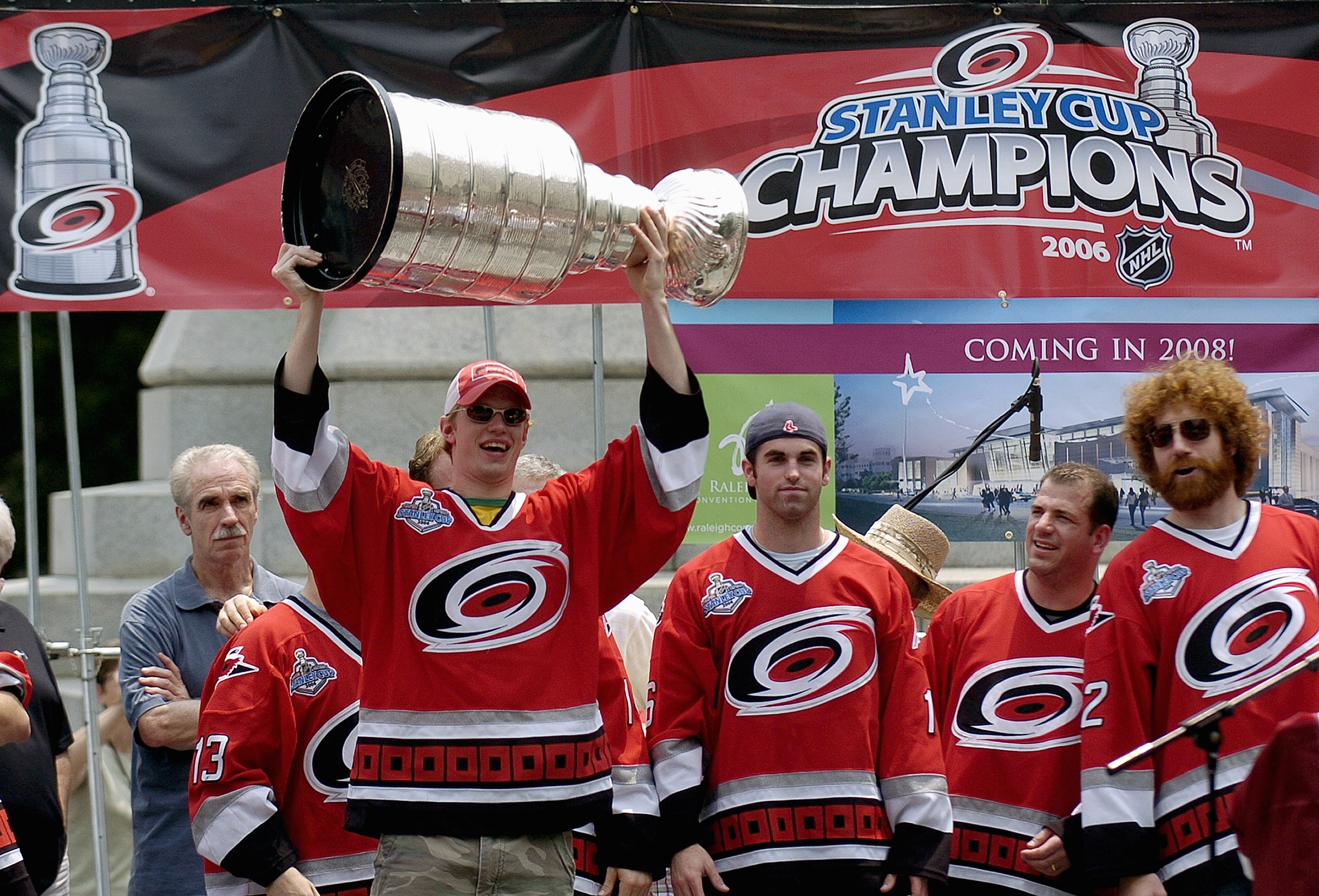 RALEIGH, NC - JUNE 21:  Eric Staal hoists the Stanley Cup overhead from the podium during a 'Hail To Our Champions' parade for the Carolina Hurricanes on June 21, 2006 to celebrate the team's Stanley Cup finals victory over the Edmonton Oilers in Raleigh,