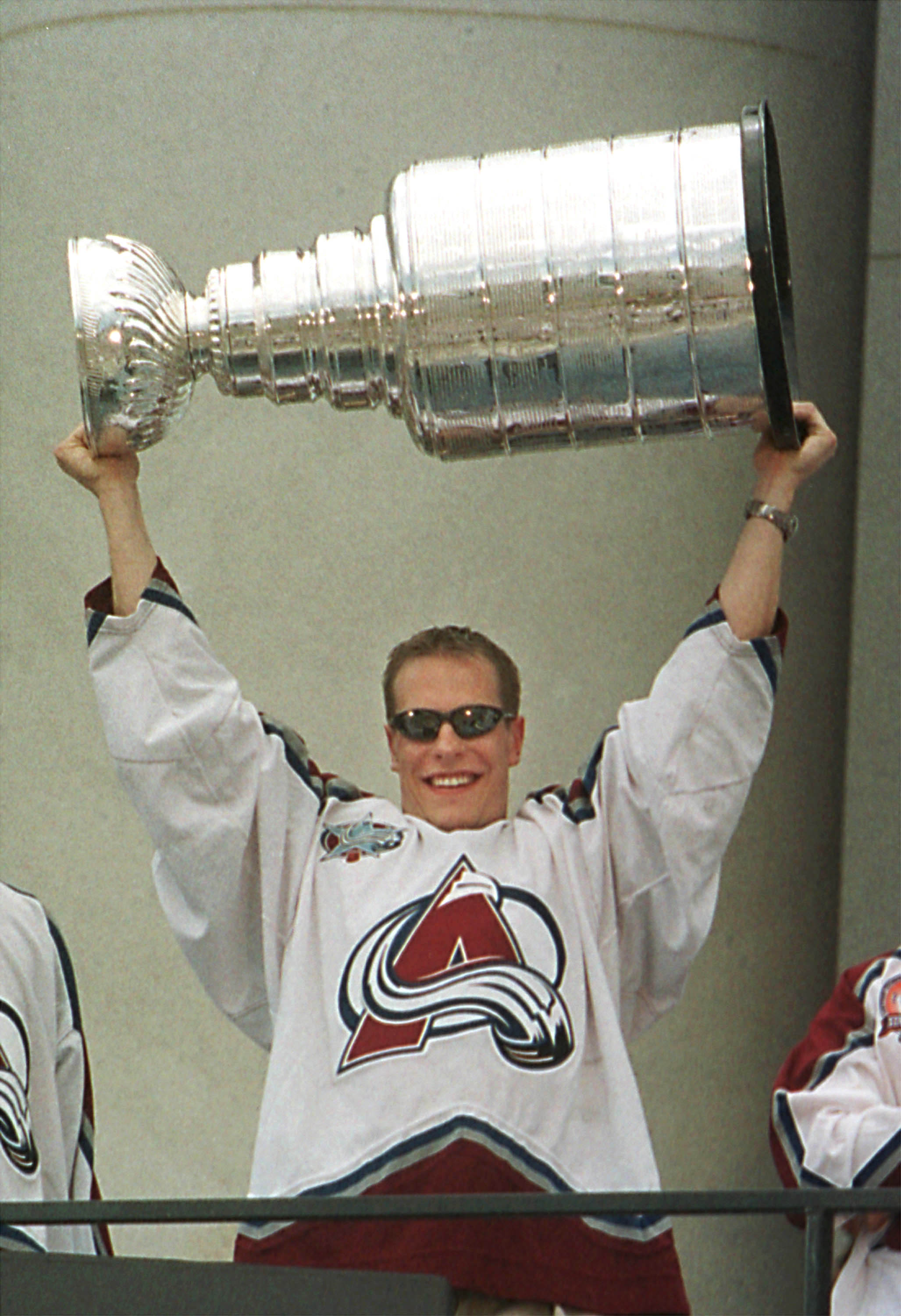 390458 02: Colorado Avalanche winger Ville Nieminen of Finland shows the Stanley Cup to fans during a victory rally at the City and County Building June 11, 2001 in downtown Denver, Colorado. (Photo by Michael Smith/Getty Images)