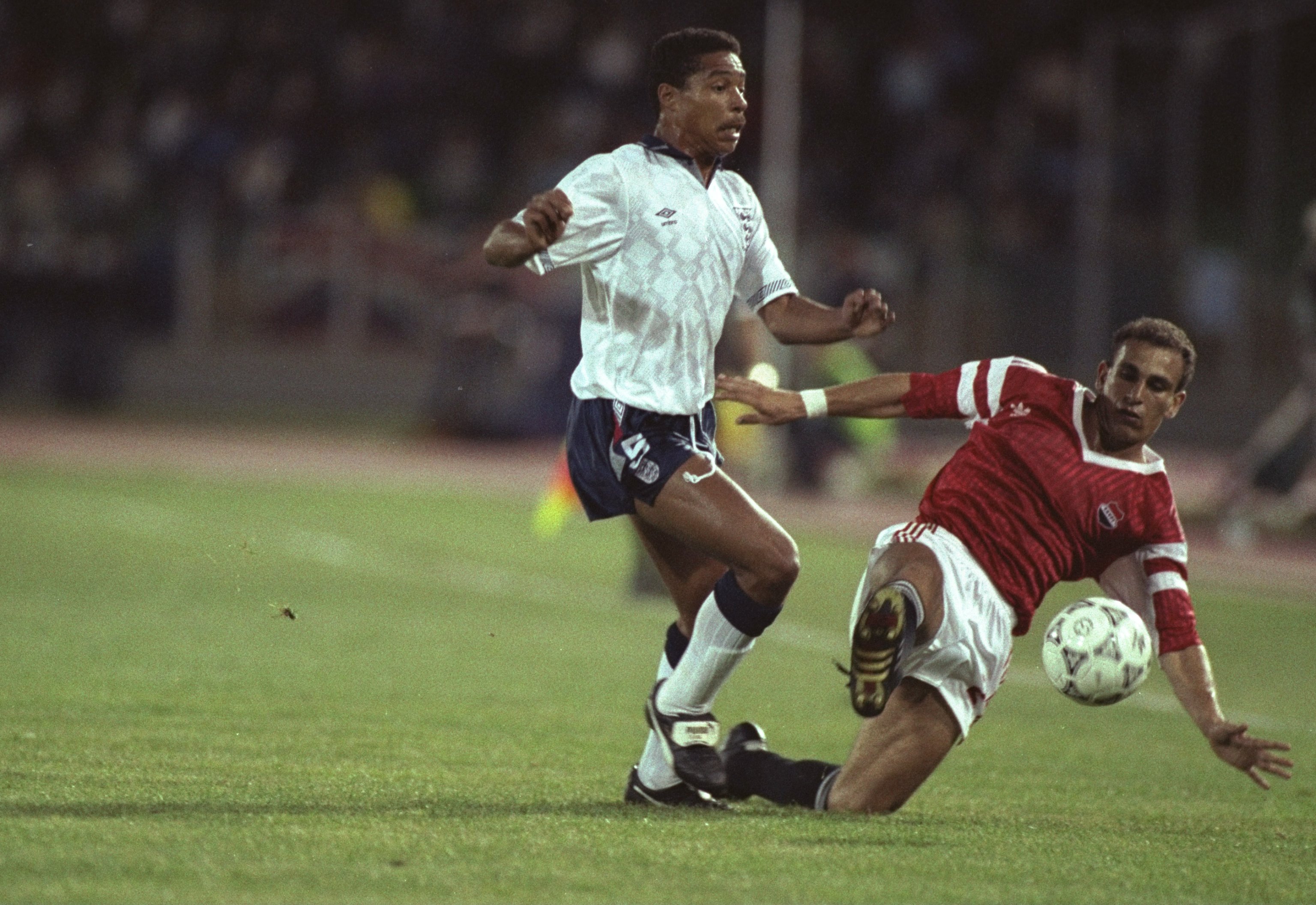 21 Jun 1990:  Des Walker (left) of England is robbed of the ball by Ibrahim Hassan (right) of Egypt during the World Cup match in Cagliari, Italy. England won the match 1-0. \ Mandatory Credit: David  Cannon/Allsport