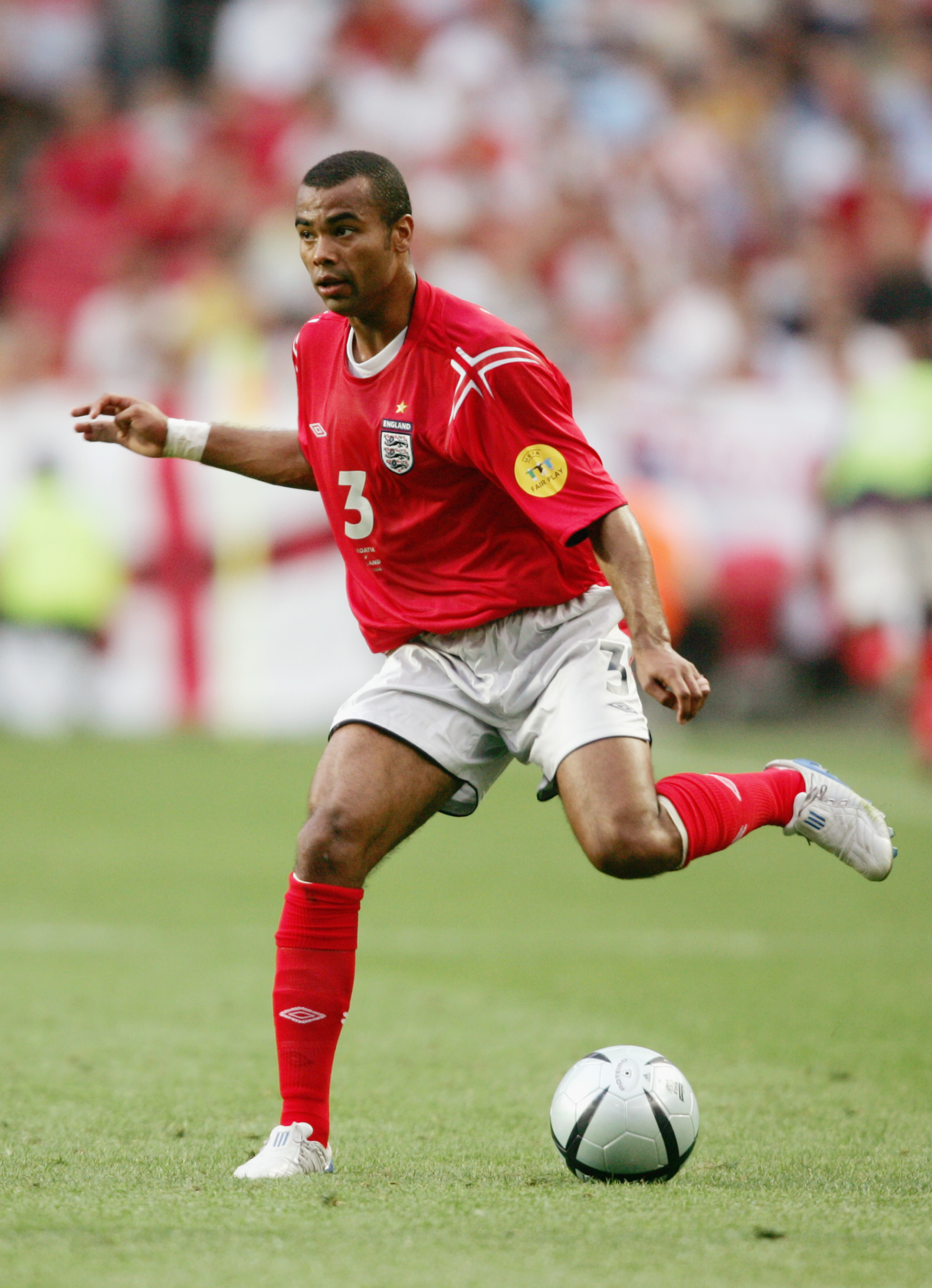 LISBON, PORTUGAL - JUNE 21:  Ashley Cole of England in action during the UEFA Euro 2004, Group B match between Croatia and England at the Luz Stadium on June 21, 2004 in Lisbon, Portugal. (Photo by Ross Kinnaird/Getty Images)