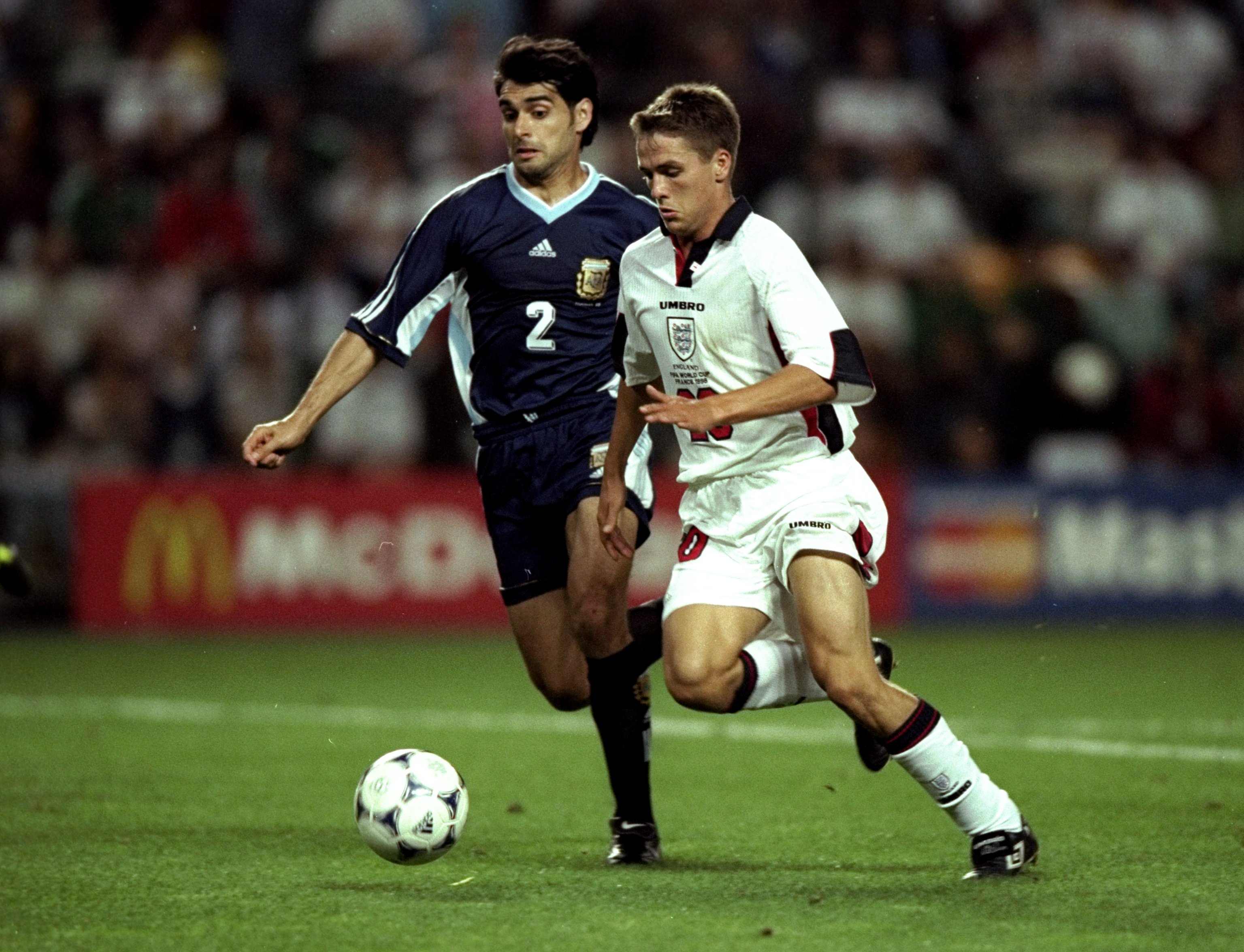 30 Jun 1998:  Michael Owen of England in action against Roberto Ayala of Argentina during the 1998 World Cup match against Argentina played in St Etienne, France.  The match finished in a 2-2 draw after extra-time and in a dramatic twist England once agai