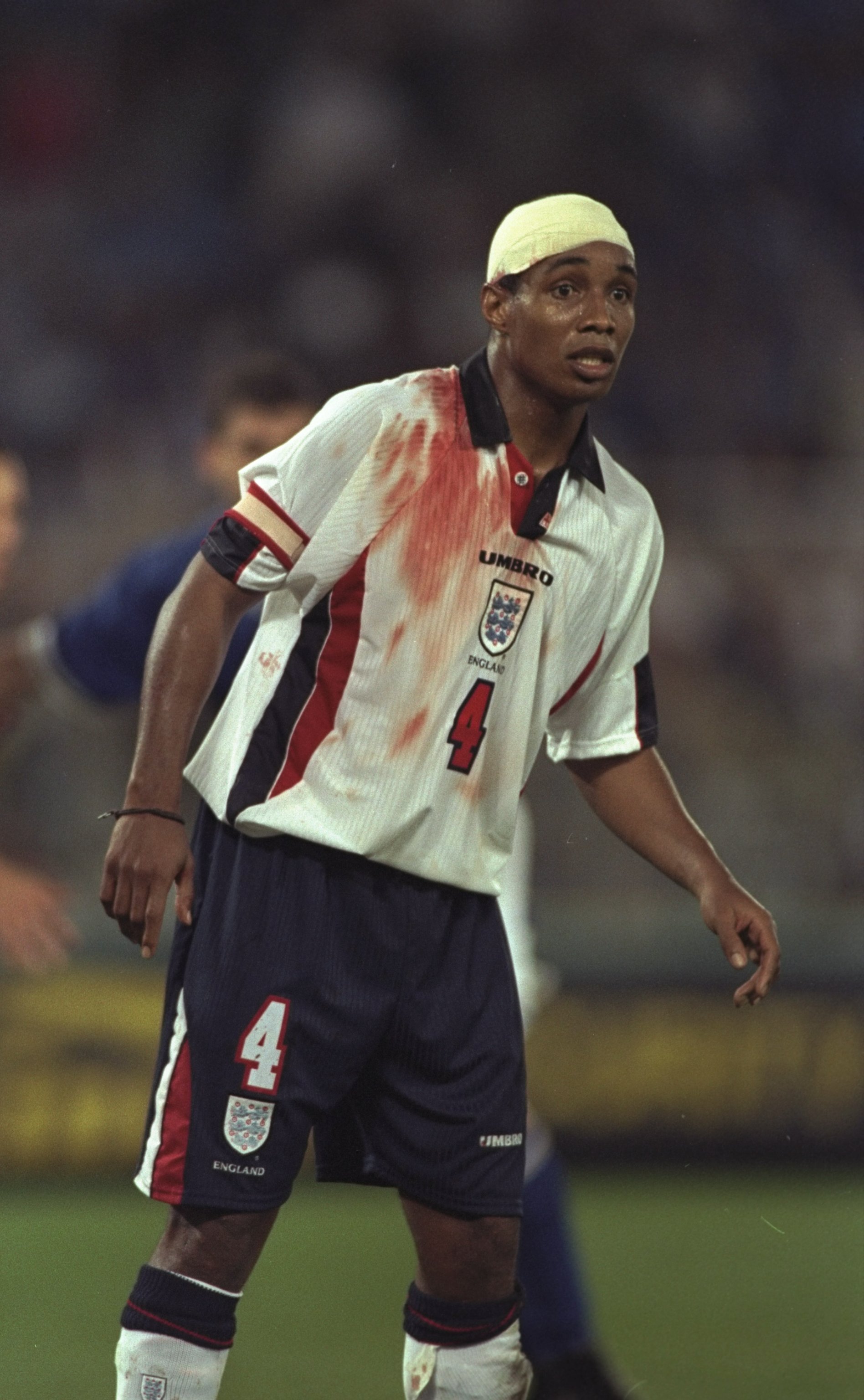 11 Oct 1997:  Paul Ince of England sports a bandage and blood stained shirt during the World Cup Qualifier against Italy at the Olympic Stadium in Rome, Italy. The game ended 0-0 and England qualified for the World Cup finals.  \ Mandatory Credit: Shaun B