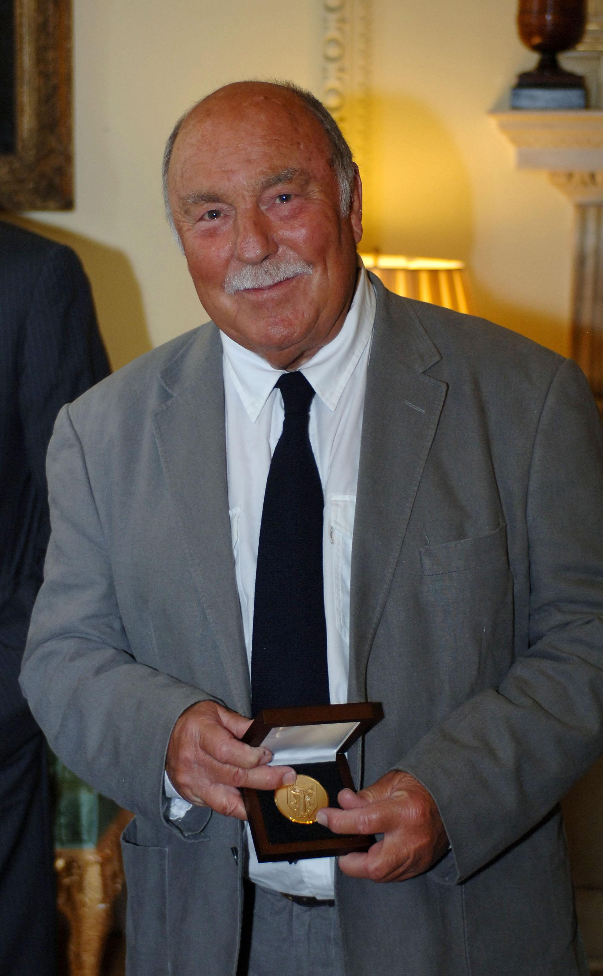 LONDON, UNITED KINGDOM - JUNE 10: Jimmy Greaves smiles after collecting his medal presented by Prime Minister Gordon Brown for representing his country in the 1966 World Cup at Downing Street on June 10, 2009 in London England. When England lifted the Wor