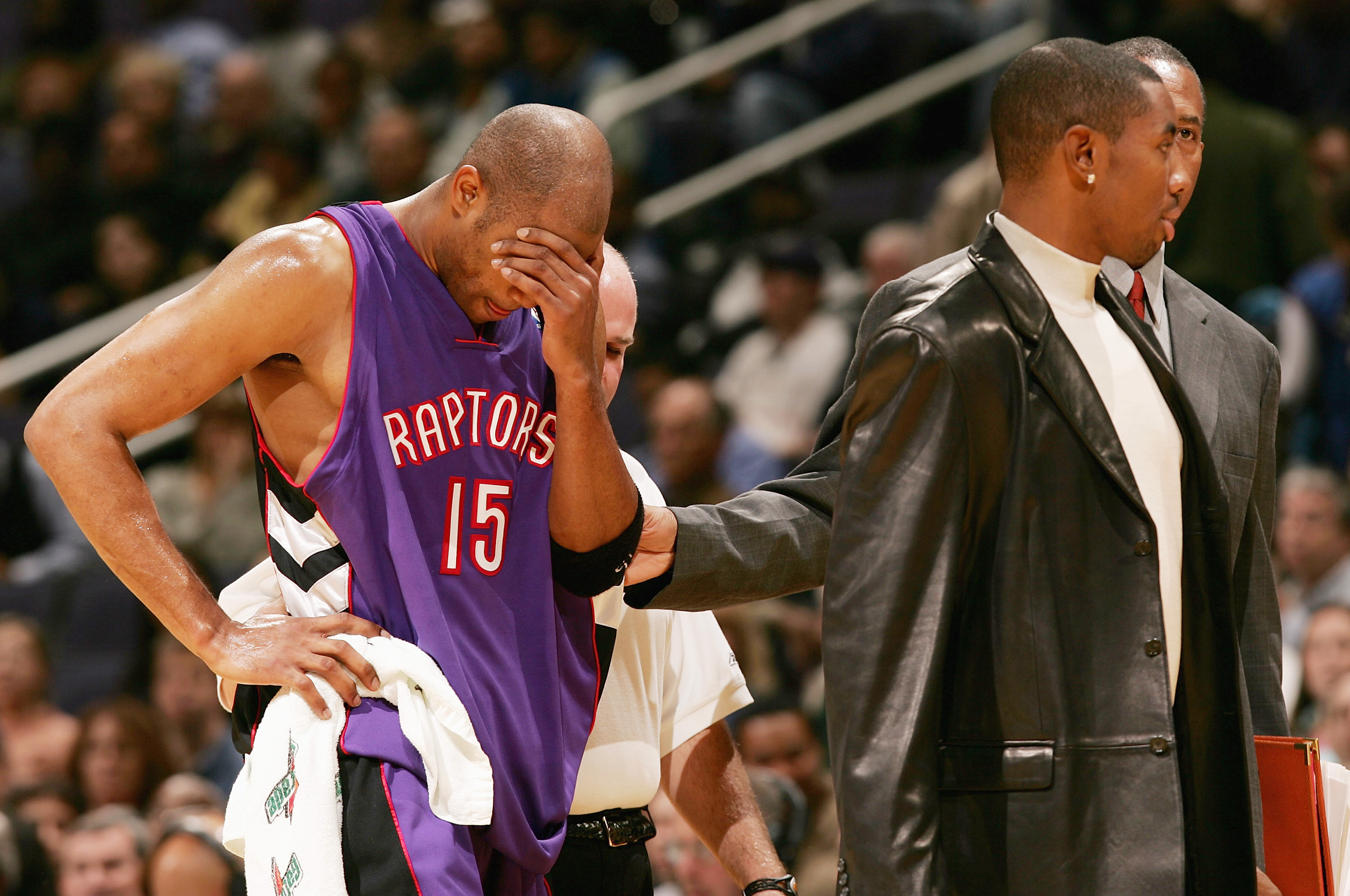 WAHINGTON DC - NOVEMBER 23:  Vince Carter #15 of the Toronoto Raptors leaves the court during the first half after he collided with Larry Hughes #20 of the Washington Wizards November 23, 2004 at the MCI Center in Washington D.C.  NOTE TO USER:  User expr