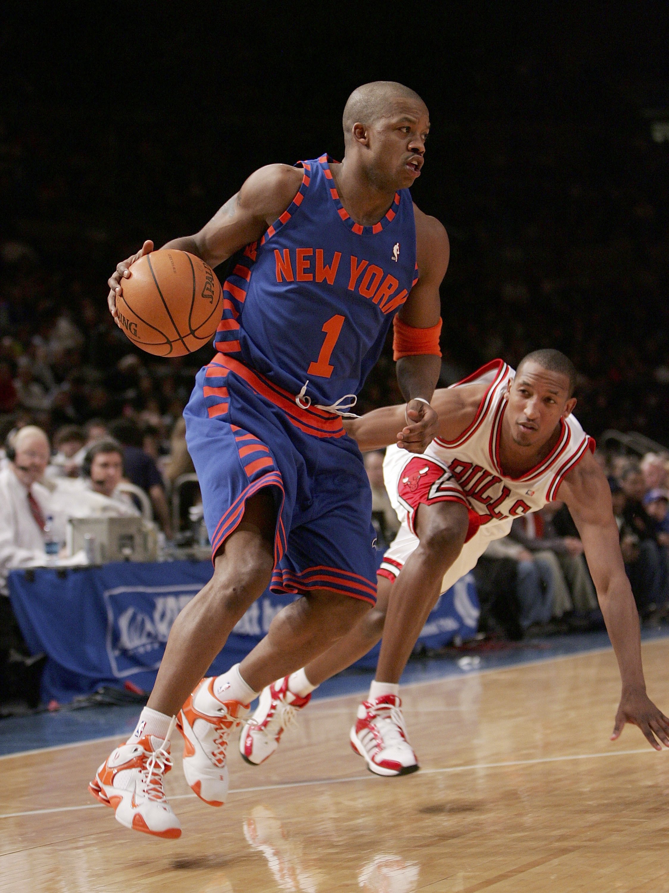 NEW YORK - MARCH 3:  Steve Francis #1 of the New York Knicks drives to the basket against Chris Duhon #21 of the Chicago Bulls on March 3, 2006 at Madison Square Garden in New York City. The Bulls defeated the Knicks 108-101.  NOTE TO USER: User expressly